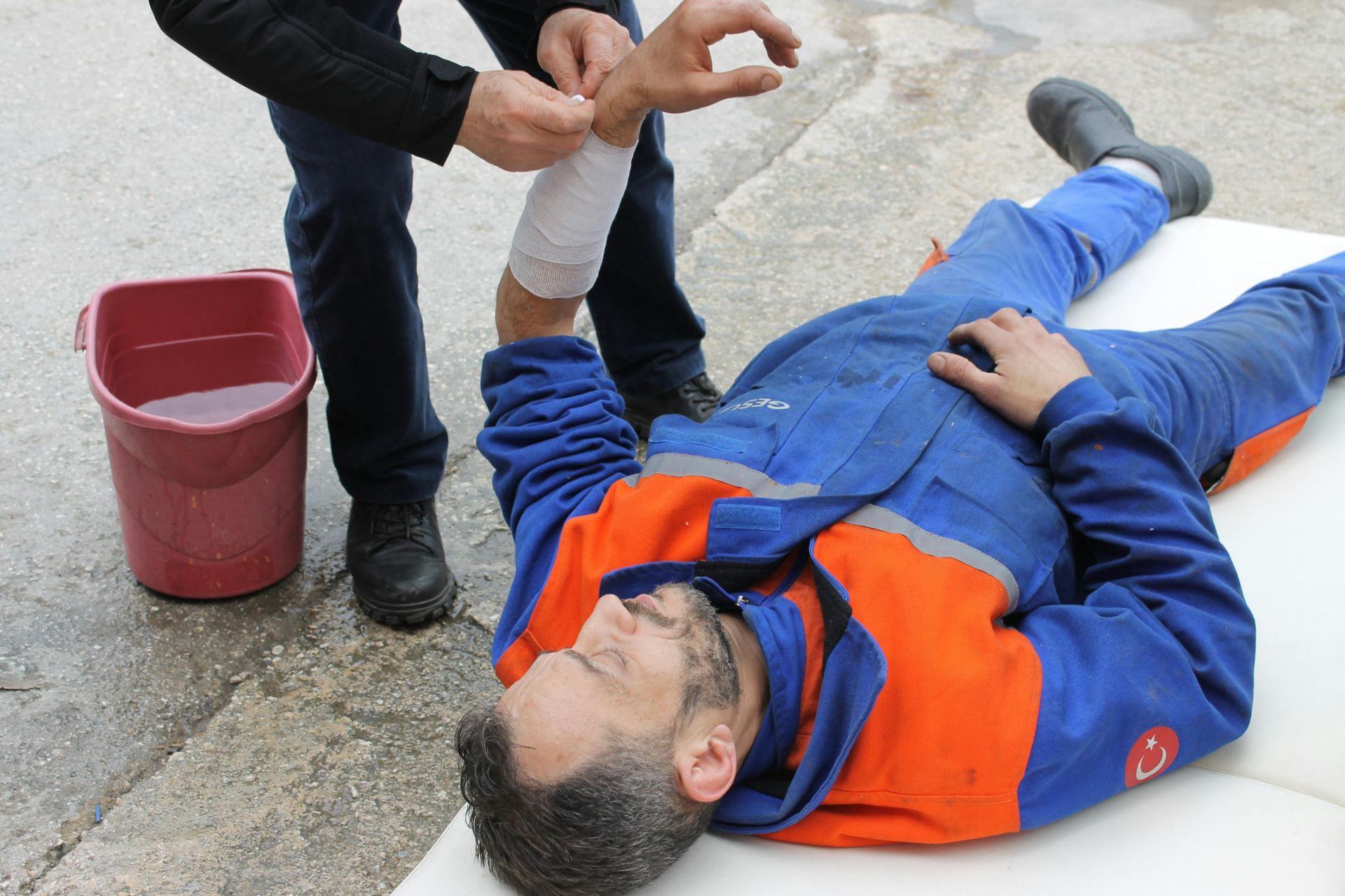 Man receiving first aid treatment